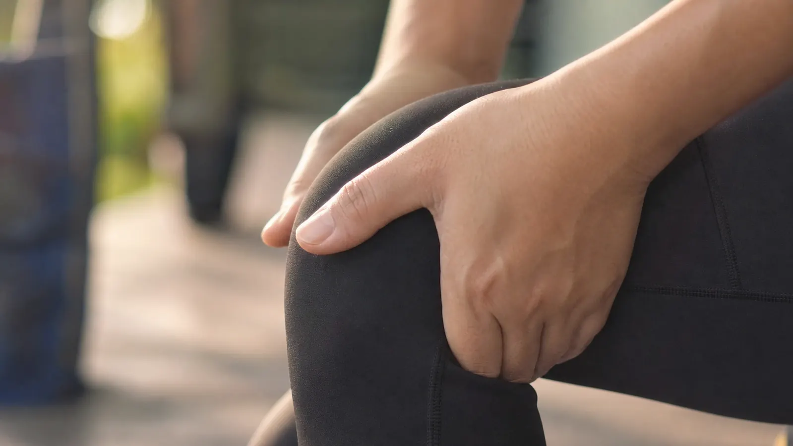 Athlete cooling down and stretching outdoors after a run